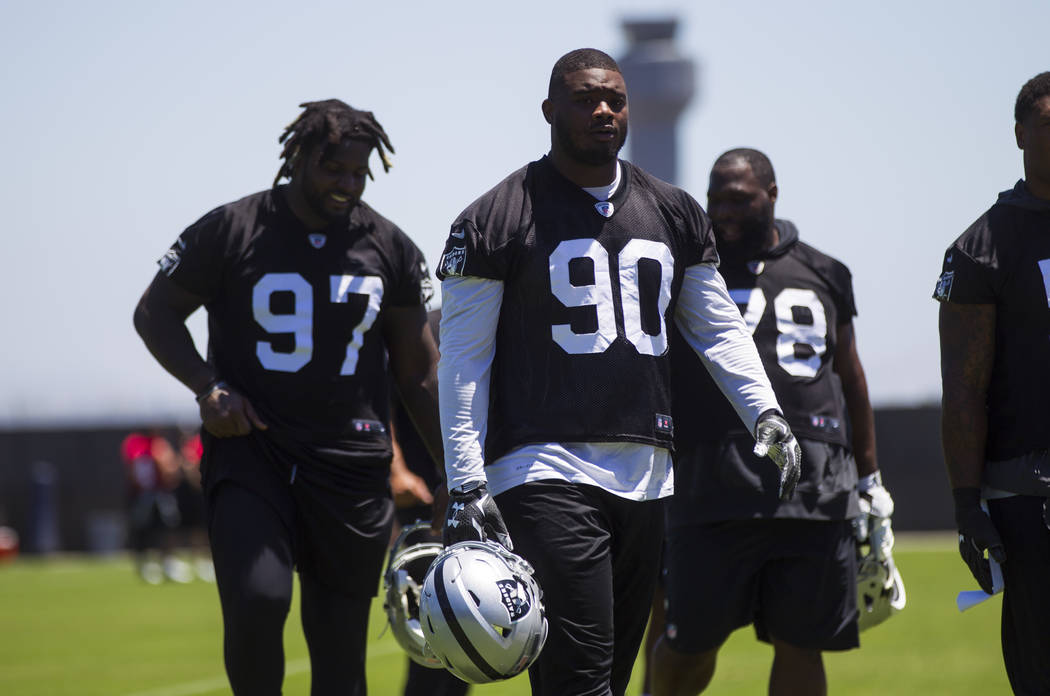 Oakland Raiders defensive tackle Treyvon Hester (90) walks off the field after finishing up day one of a mini-camp at the Raiders headquarters and training facility in Alameda, Calif. on Tuesday,  ...