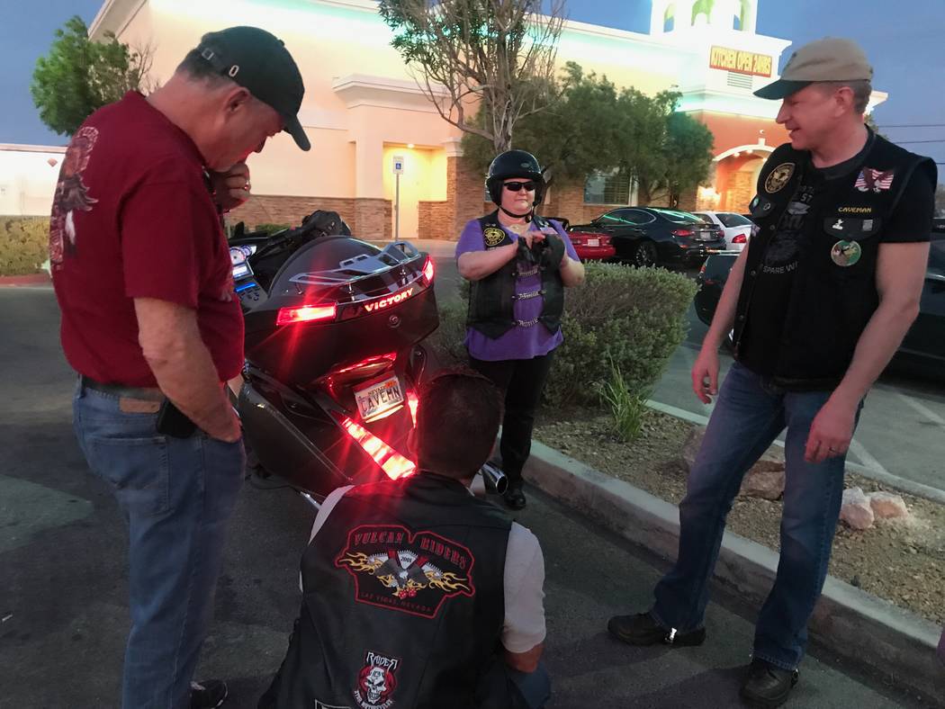 Original founder and former president of Vegas Vulcan Riders, Sam Brown, chats with members right, John, and Deedee, after a monthly meeting in the parking lot of Town Center Lounge II, 2992 W. Ch ...