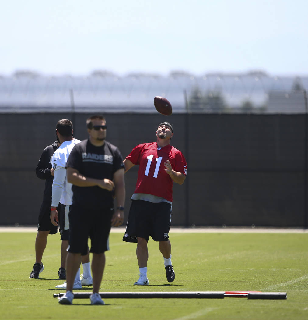 Oakland Raiders kicker Sebastian Janikowski (11) throws a ball around during day two of a mini-camp at the Raiders headquarters and training facility in Alameda, Calif. on Wednesday, June 14, 2017 ...