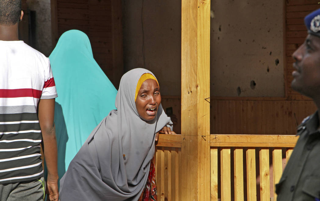 A mother whose daughter was shot in the head by attackers during a militant attack on a restaurant, grieves in Mogadishu, Somalia Thursday, June 15, 2017. Somalia's security forces early Thursday  ...