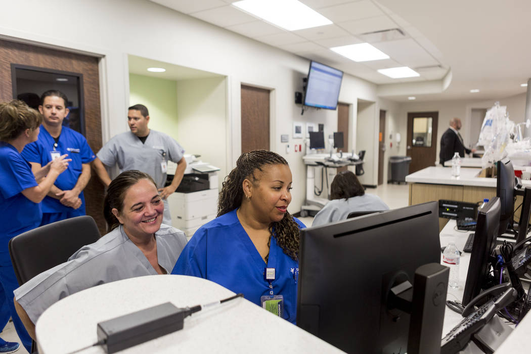 Emergency room technician Lisa Markowicz, and  registered nurse Philana Thomas work on the computer in the new Dignity Health-St. Rose Dominican North Las Vegas campus, Thursday, June 15, 2017. El ...