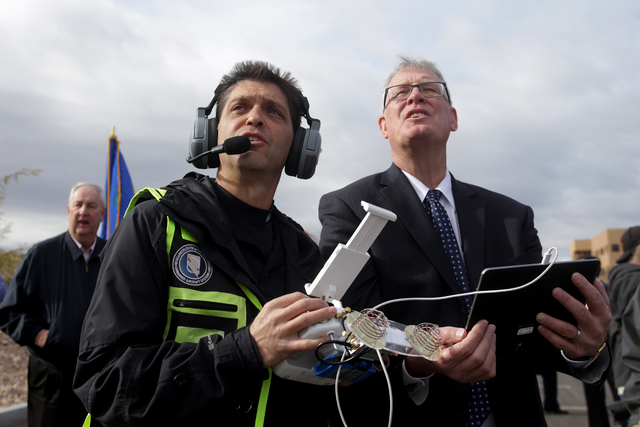Kevin Fallico, the Director of Operations for Avisight, helps Henderson Mayor Andy Hafen fly a drone at an event to break ground on Nevada's first unmanned aerial systems urban test site on Wednes ...