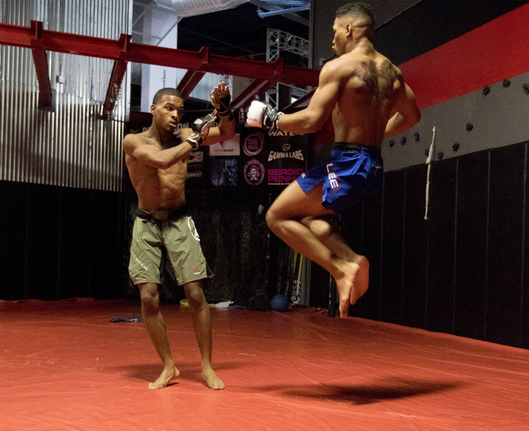 UFC lightweight Kevin Lee, right, attempts a flying knee while training  with his brother Keith Lee at One Kick's Gym in Las Vegas, Tuesday, June 6,  2017. Heidi Fang /Las Vegas Review-Journal @