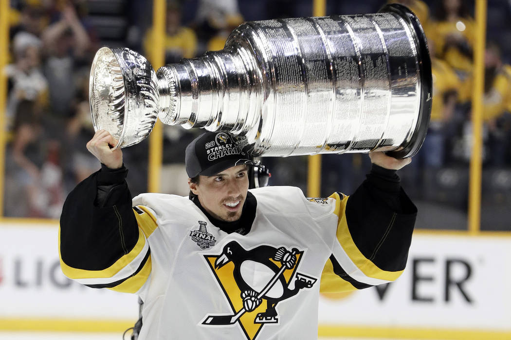 Pittsburgh Penguins goalie Marc-Andre Fleury celebrates with the Stanley Cup  after the Penguins defeated the Nashville Predators 2-0 in Game 6 of the  NHL hockey Stanley Cup Finals Sunday, June 11, … |