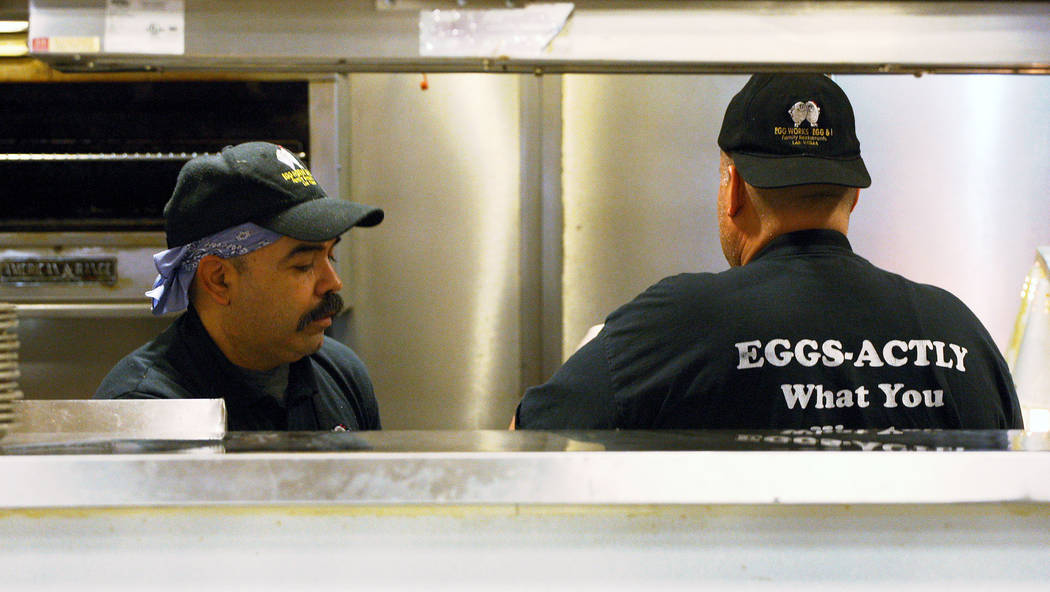 Egg Works employees Nicholas Muñoz, left, and Octavio Tovar prepare breakfast orders for customers, Tuesday, June 20, 2017. Gabriella Benavidez Las Vegas Review-Journal @latina_ish