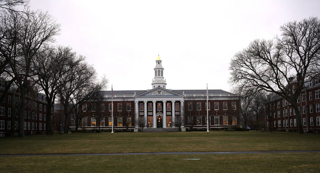FILE - In this March 7, 2017 file photo, the Baker Library at the Harvard Business School is shown on the campus of Harvard University in Cambridge, Mass. A debate over the appropriateness of the  ...