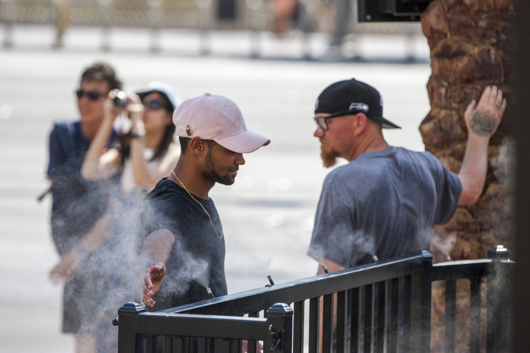 Gbaga Yohan of Bordeaux, France, cools off with misters on the Las Vegas Strip as the temperature reached 116 on Tuesday, June 20, 2017. Patrick Connolly Las Vegas Review-Journal @PConnPie