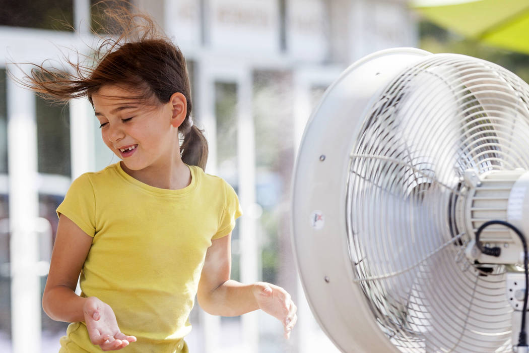Adrianna Kostrzewa, 7, of Santa Barbra, Calif., cools off with misters on the Strip in Las Vegas as the temperature reached 116 on Tuesday, June 20, 2017. Patrick Connolly Las Vegas Review-Journa ...