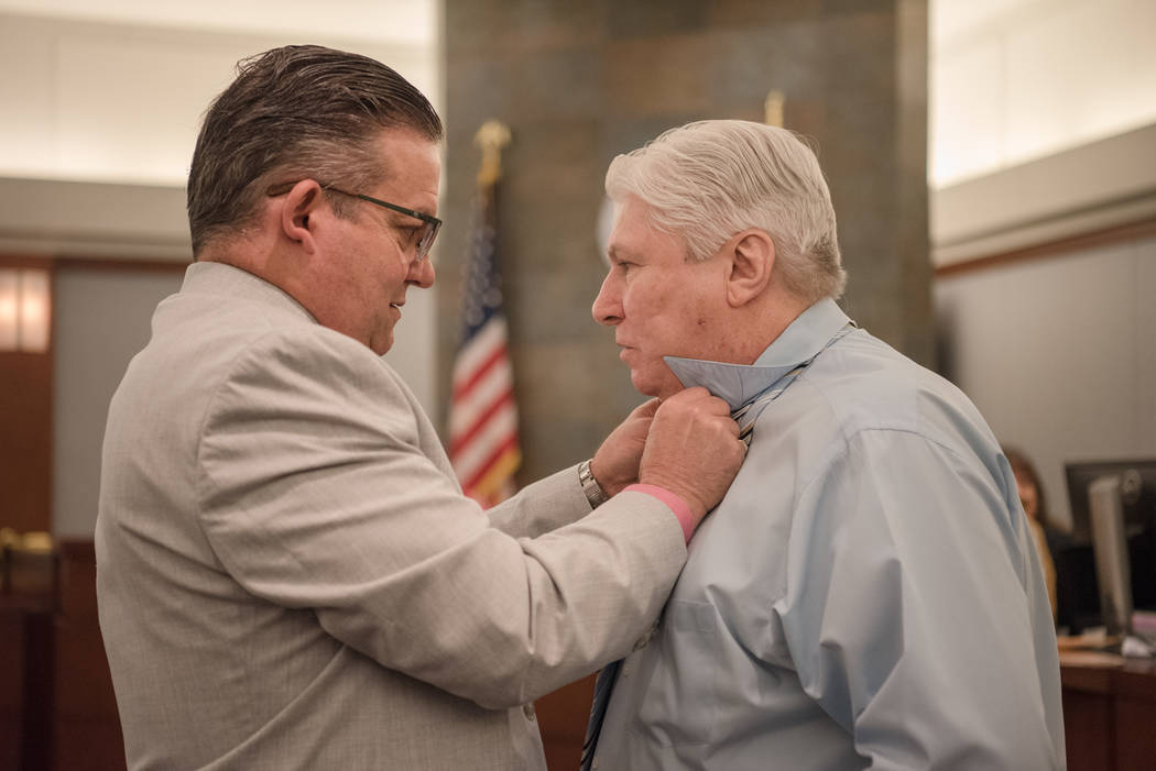 Attorney Clark Patrick helps Thomas Randolph with his tie before trial on Wednesday, June 21, 2017, at Regional Justice Center in Las Vegas. Morgan Lieberman Las Vegas Review-Journal