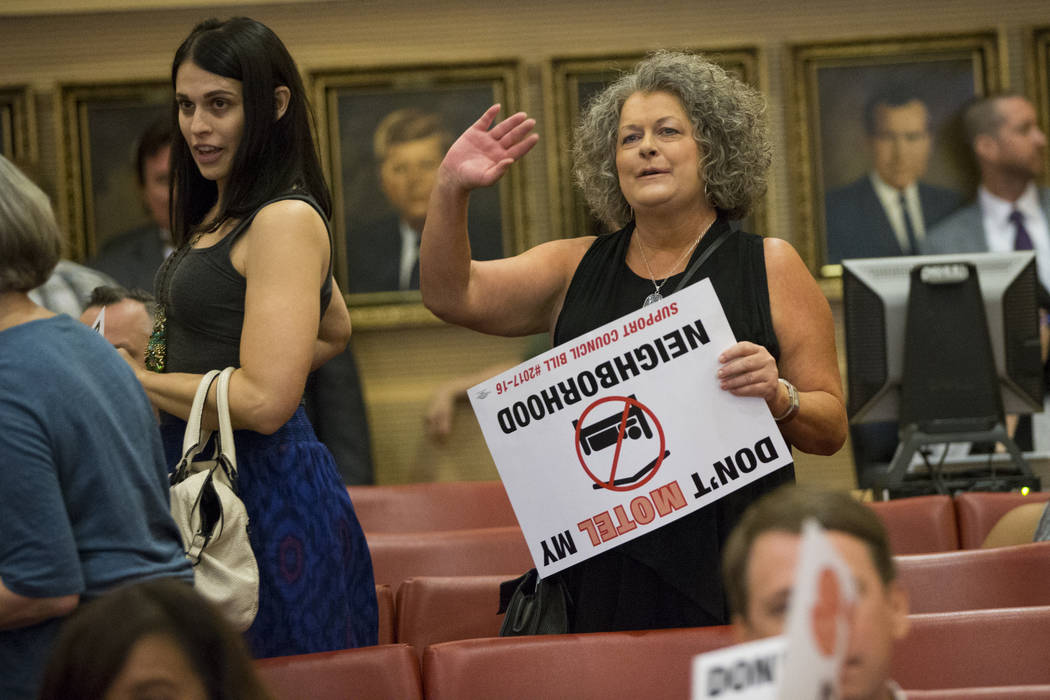 Local resident Shelly, right, waves at the council members after their vote regarding short-term rentals during a city council meeting at Las Vegas City Hall on Wednesday, June 21, 2017, in Las Ve ...