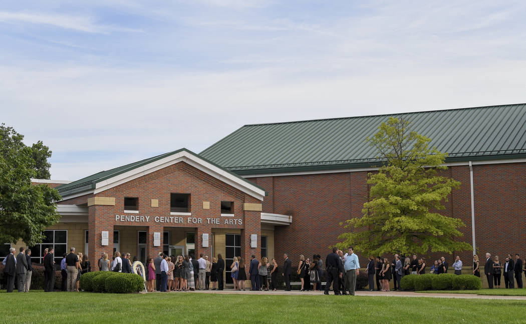 Mourners line up for the funeral of Otto Warmbier, Thursday, June 22, 2017, in Wyoming, Ohio. Warmbier, a 22-year-old University of Virginia undergraduate student who was sentenced in March 2016 t ...