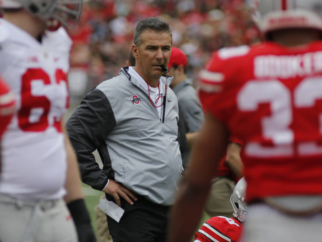 Ohio State head coach Urban Meyer watches from behind the line of scrimmage during their NCAA college spring football game Saturday, April 15, 2017, in Columbus, Ohio. (AP Photo/Jay LaPrete)