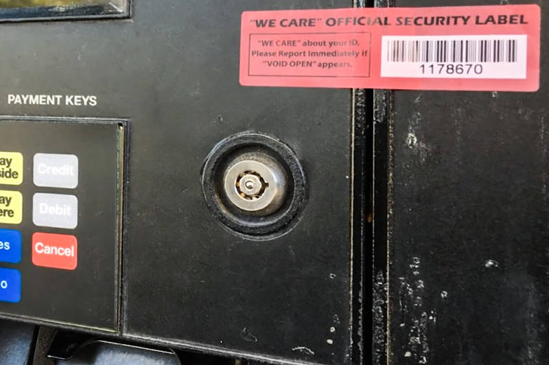 The red seal tape used to protect gas pump card readers is often replaced with new tape bought from the "dark web," so Williams said to look for tear marks. (Henderson Police Department)