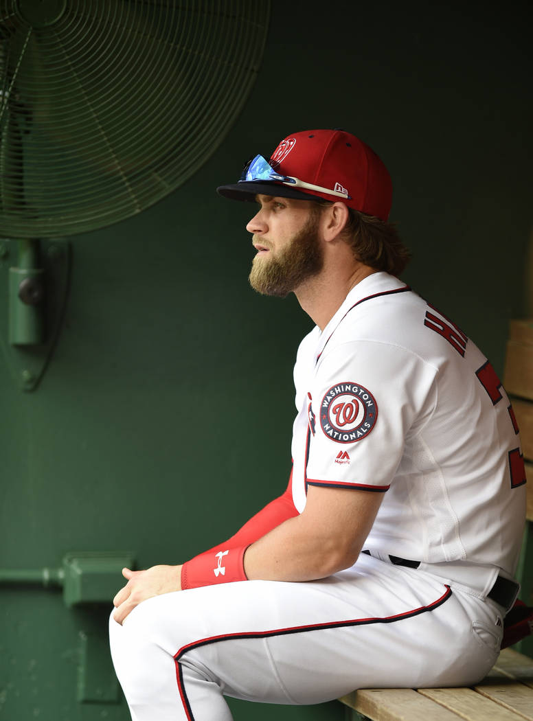 Washington Nationals' Bryce Harper sits in the dugout before a baseball game against the Cincinnati Reds, Saturday, June 24, 2017, in Washington. (AP Photo/Nick Wass)