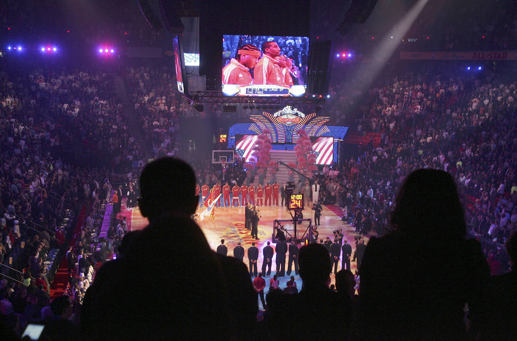 Basketball fans stand as Clint Holmes sings the National Anthem on Sunday, Feb. 18, 2007 during the All-Star basketball game at the Thomas and Mack Center in Las Vegas. (John Gurzinski/Las Vegas R ...