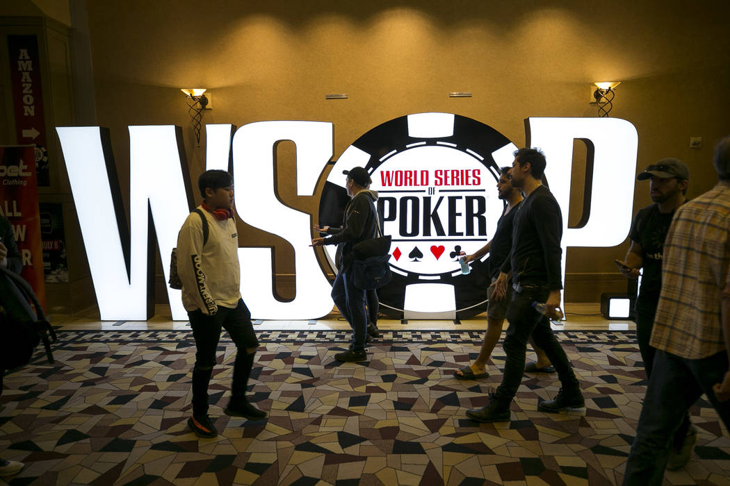 People walk past a WSOP display during the World Series of Poker on Monday, June 26, 2017, at the Rio hotel-casino, in Las Vegas. (Richard Brian/Las Vegas Review-Journal) @vegasphotograph