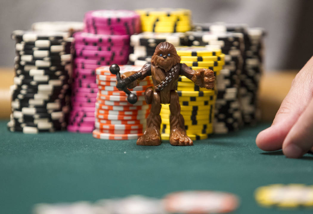 A poker player keeps a Chewbacca figurine by his chips as a good luck charm during the World Series of Poker on Monday, June 26, 2017, at the Rio hotel-casino, in Las Vegas. (Richard Brian/Las Veg ...