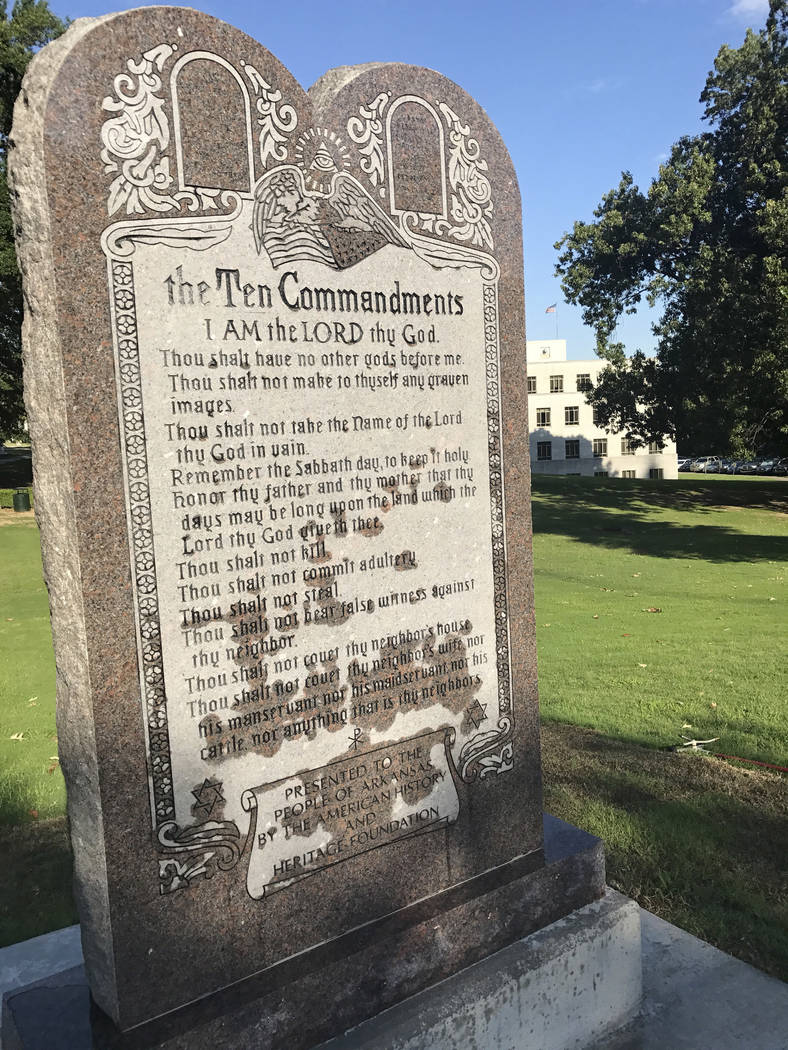 A 6-foot-tall privately funded Ten Commandments monument is seen on the Arkansas Capitol grounds in Little Rock on Tuesday, June 27, 2017, after it was installed by workers two years after lawmake ...