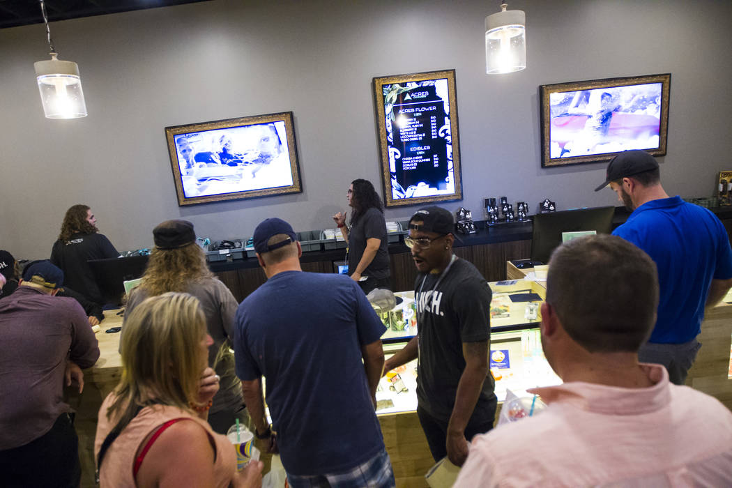 Customers browse through marijuana products during the first day of recreational sales at Acres Cannabis in Las Vegas on Saturday, July 1, 2017. Chase Stevens Las Vegas Review-Journal @csstevensphoto