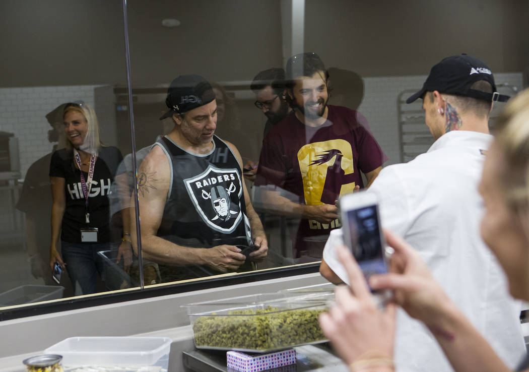 Customers take a look at the kitchen area at Acres Cannabis during the first day of recreational sales in Las Vegas on Saturday, July 1, 2017. Chase Stevens Las Vegas Review-Journal @csstevensphoto