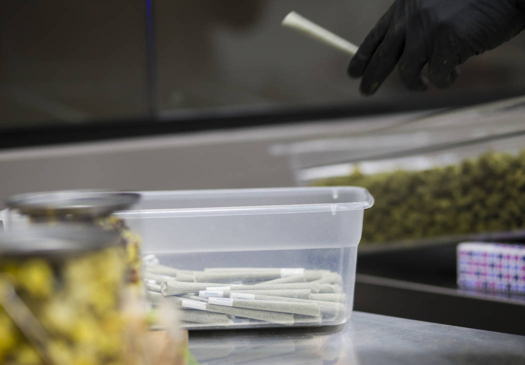 Anthony Hubbard prepares rolled joints in the kitchen area at Acres Cannabis during the first day of recreational sales in Las Vegas on Saturday, July 1, 2017. Chase Stevens Las Vegas Review-Journ ...
