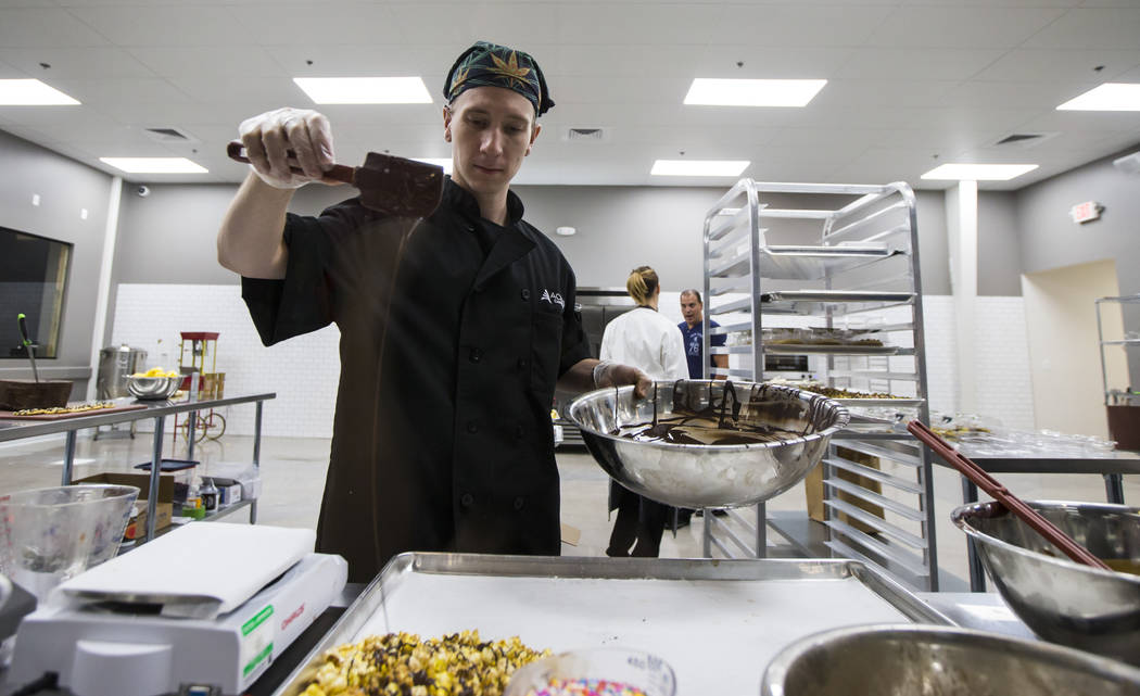 Brian Orr works on making edible marijuana products in the kitchen area at Acres Cannabis during the first day of recreational sales in Las Vegas on Saturday, July 1, 2017. Chase Stevens Las Vegas ...