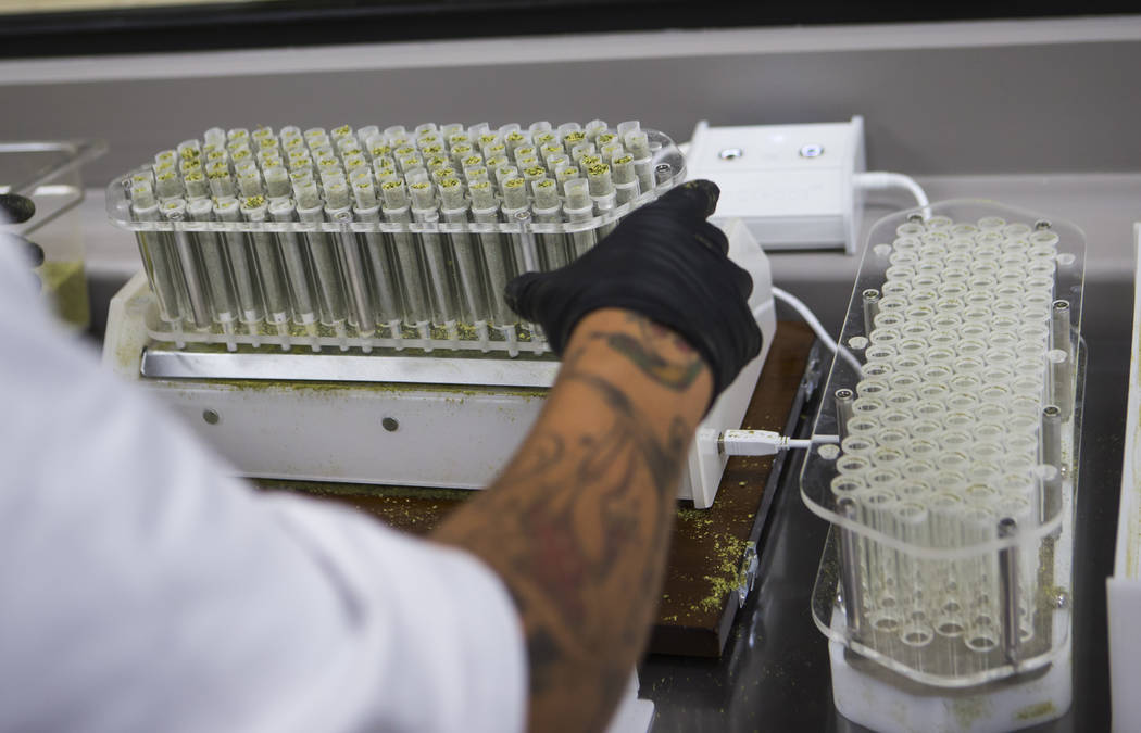 Anthony Hubbard prepares rolled joints in the kitchen area at Acres Cannabis during the first day of recreational sales in Las Vegas on Saturday, July 1, 2017. Chase Stevens Las Vegas Review-Journ ...