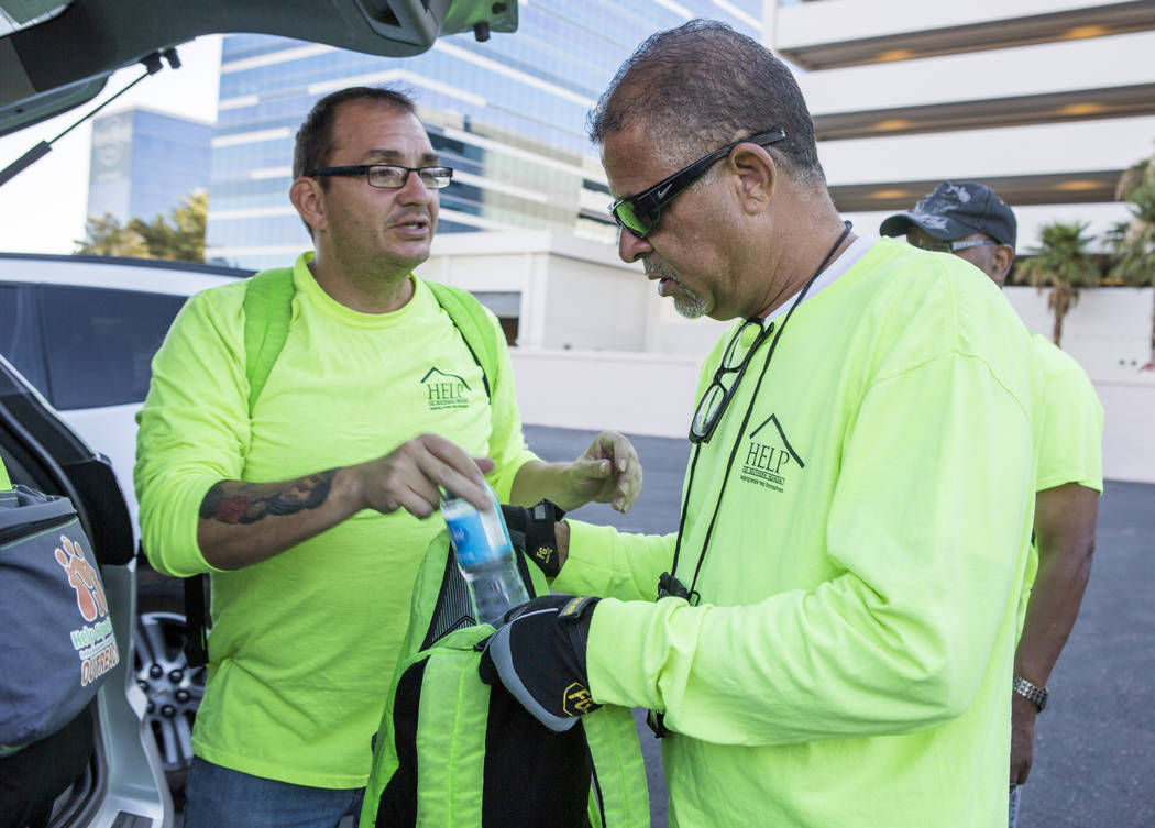 HELP of Southern Nevada employees Louis Lacey, right, and Christie Medina pack water for the homeless in flood tunnels near the Hard Rock hotel-casino on Tuesday, June 27, 2017. Patrick Connolly ...