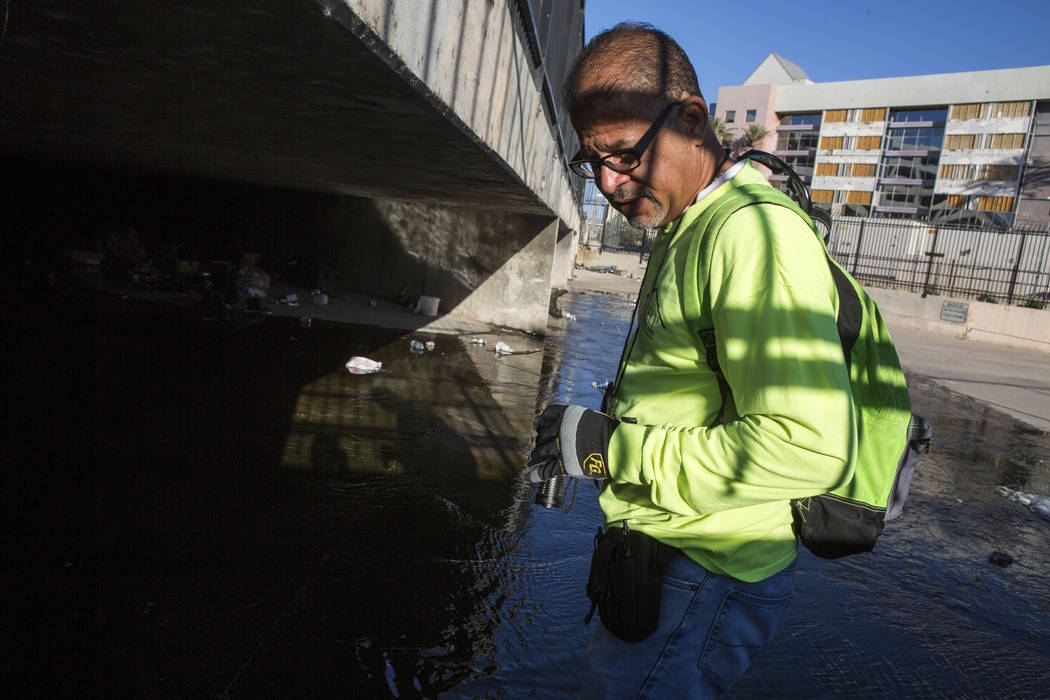 HELP of Southern Nevada employee Louis Lacey, the Mobile Crisis Intervention Team manager, prepares to enter another flood tunnel near the Hard Rock hotel-casino on Tuesday, June 27, 2017. Patric ...