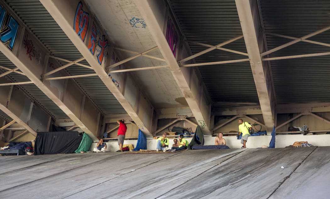 HELP of Southern Nevada and U.S. Vets employees check on homeless people underneath Interstate 15 near the Rio hotel-casino on Thursday, June 29, 2017. Patrick Connolly Las Vegas Review-Journal @ ...