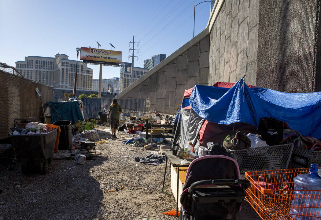 A man who preferred to be called Papa Smurf walks by his tent and shelter near the Rio hotel-casino on Thursday, June 29, 2017. Patrick Connolly Las Vegas Review-Journal @PConnPie