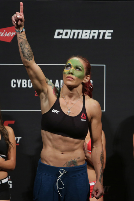 Brazil's Cristiane Justino, known as "Cris Cyborg," poses during the weigh-in for her UFC Fight Night in Brasilia, Brazil, Friday, Sept. 23, 2016. Their fight is set for Saturday ...