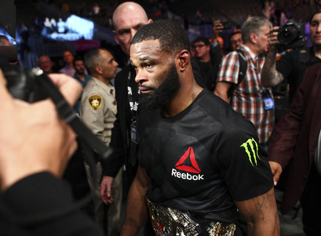 Tyron Woodley of the United States leaves the octagon after defeating Stephen Thompson of the United States via majority decision in their welterweight title bout at UFC 209 at T-Mobile Arena in L ...