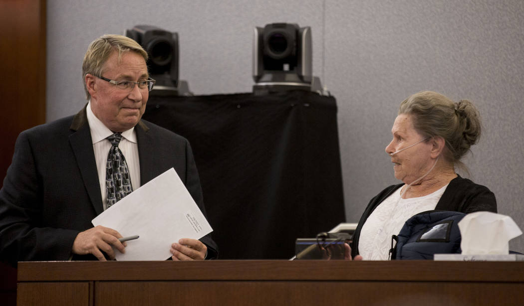 Public defender Randall Pike speaks with Dorothy Arlene Randolph, mother of defendant Thomas Randolph, during Randolph's trial at the Regional Justice Center in Las Vegas, Thursday, June 29, 2017. ...