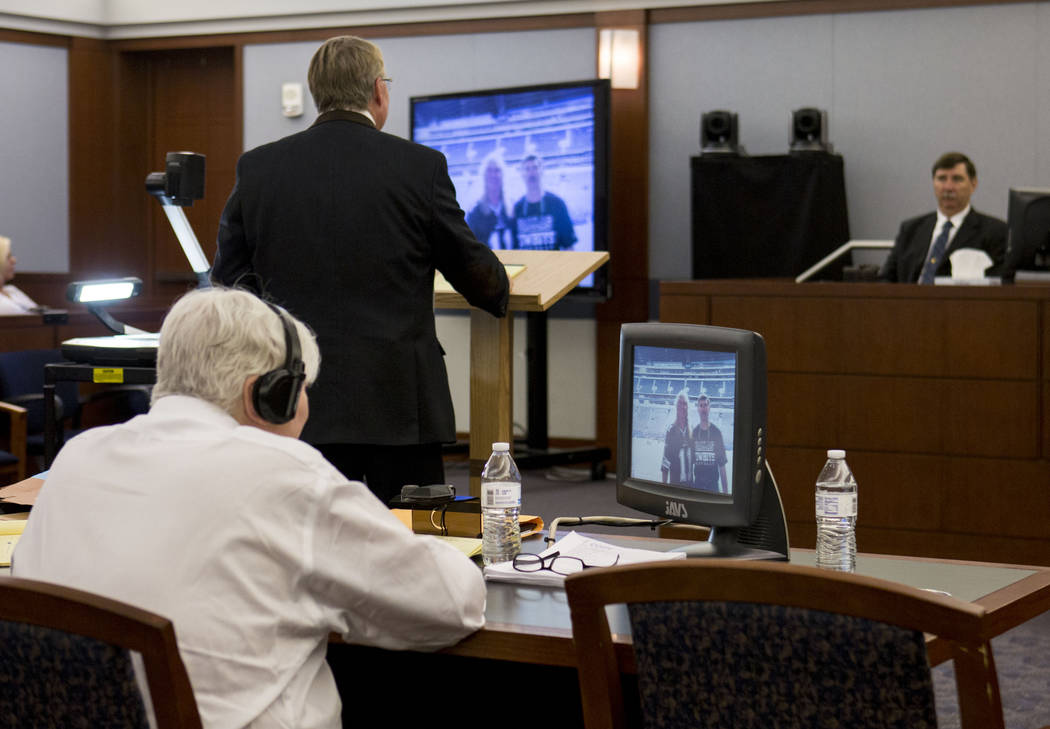 Defendant Thomas Randolph looks at a photograph with his brother Jospeh Randolph during his trial at the Regional Justice Center in Las Vegas, Thursday, June 29, 2017. Elizabeth Brumley Las Vegas ...