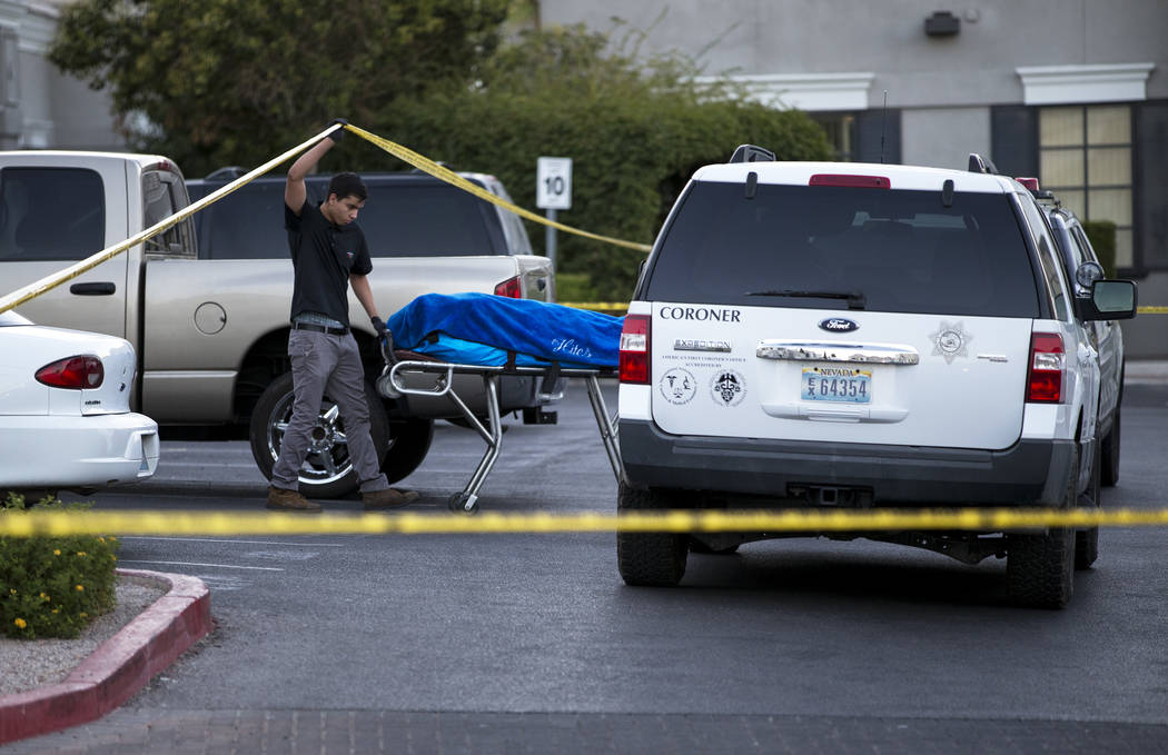 A body is removed as investigators work the scene of a shooting at a wellness and pain care facility at 311 North Buffalo Drive in Las Vegas on Thursday, June 29, 2017. Richard Brian Las Vegas Rev ...