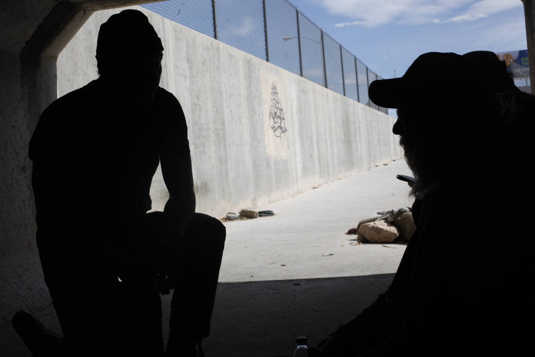 Matthew O'Brien speaks to Cory  near an entrance to the flood tunnels on Tuesday, May 16, 2017, in Las Vegas. O'Brien spent years interviewing the hundreds of people that live there, eventually wr ...