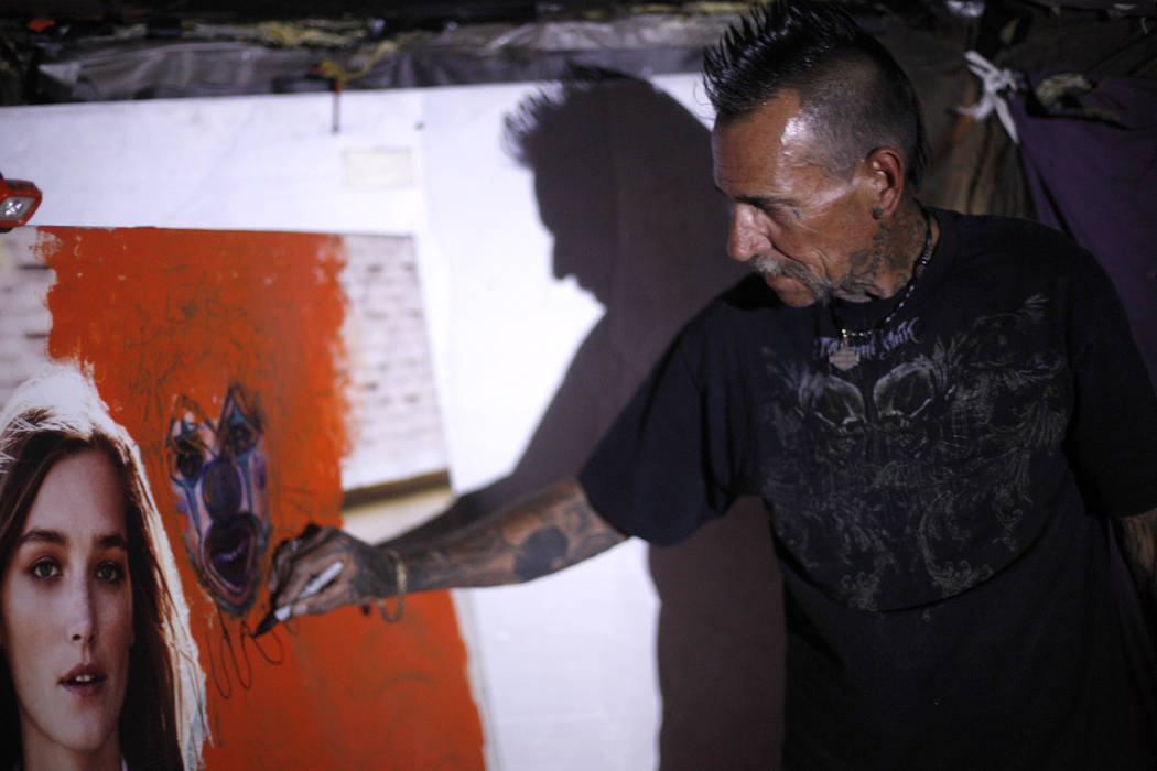 &quot;Spike&quot; draws a clown on a poster at his encampment inside a flood tunnel on Tuesday, May 16, 2017, in Las Vegas. Rachel Aston Las Vegas Review-Journal @rookie__rae