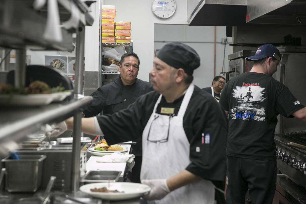 From left: Chris Sjafiroeddin, executive chef,  supervises the kitchen while Randy Gonsales, second lead, and Michael Scott, line cook, prepare orders at the Club Fortune Casino in Henderson, Wedn ...