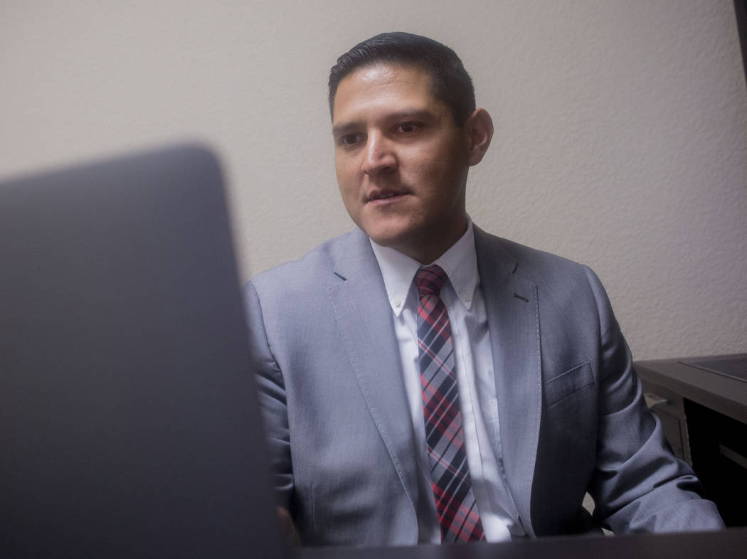 Associate with World Financial Group Eric Rodriguez at the office in