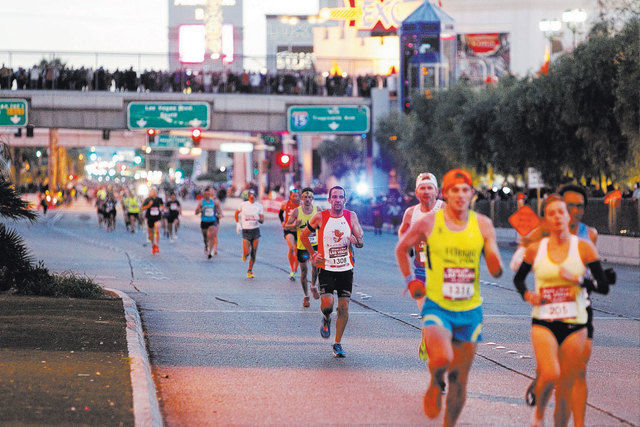 Runners compete during the Rock 'n' Roll Las Vegas marathon on the Strip near Monte Carlo casino-hotel in Las Vegas Sunday, Nov. 16, 2014. (Erik Verduzco/Las Vegas Review-Journal)