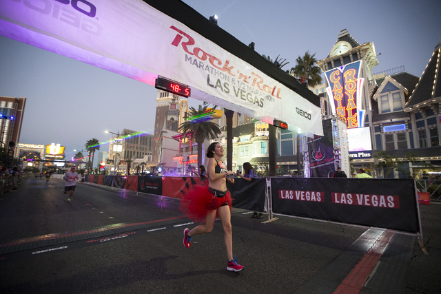 Martha Williams completes the 10K run in the annual Rock ‘n’ Roll Marathon at the Strip near The Mirage hotel-casino on Sunday, Nov. 13, 2016, in Las Vegas. Erik Verduzco/Las Vegas R ...