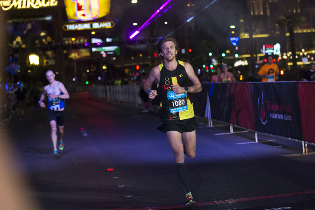 Eric Fitzpatrick, right, races for second place in front of Chip O'hara in the Rock-n-Roll Marathon at the Strip near The Mirage hotel-casino on Sunday, Nov. 13, 2016, in Las Vegas. Erik Verduzco/ ...