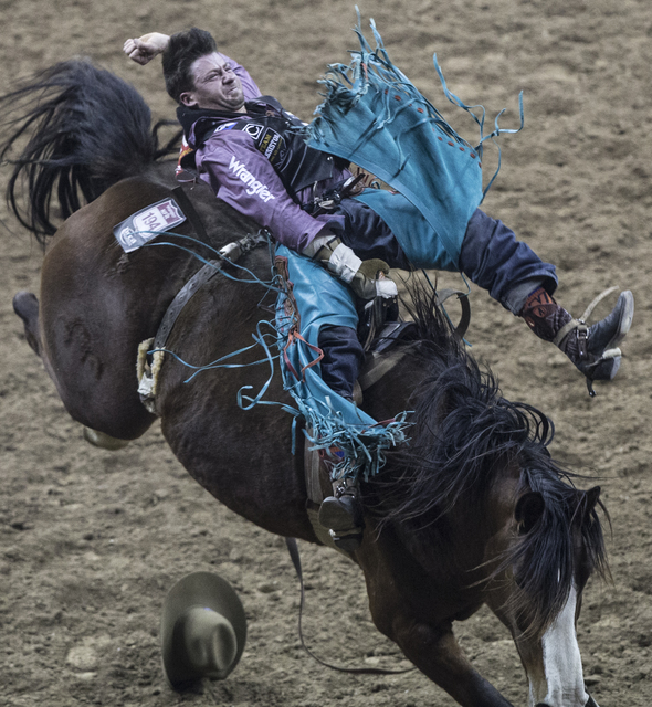 Wyatt Denny rides Angel Eyes during the bareback riding competition at the National Finals Rodeo at the Thomas & Mack Center on Wednesday, Dec. 7, 2016, in Las Vegas. (Benjamin Hager/Las Vegas ...