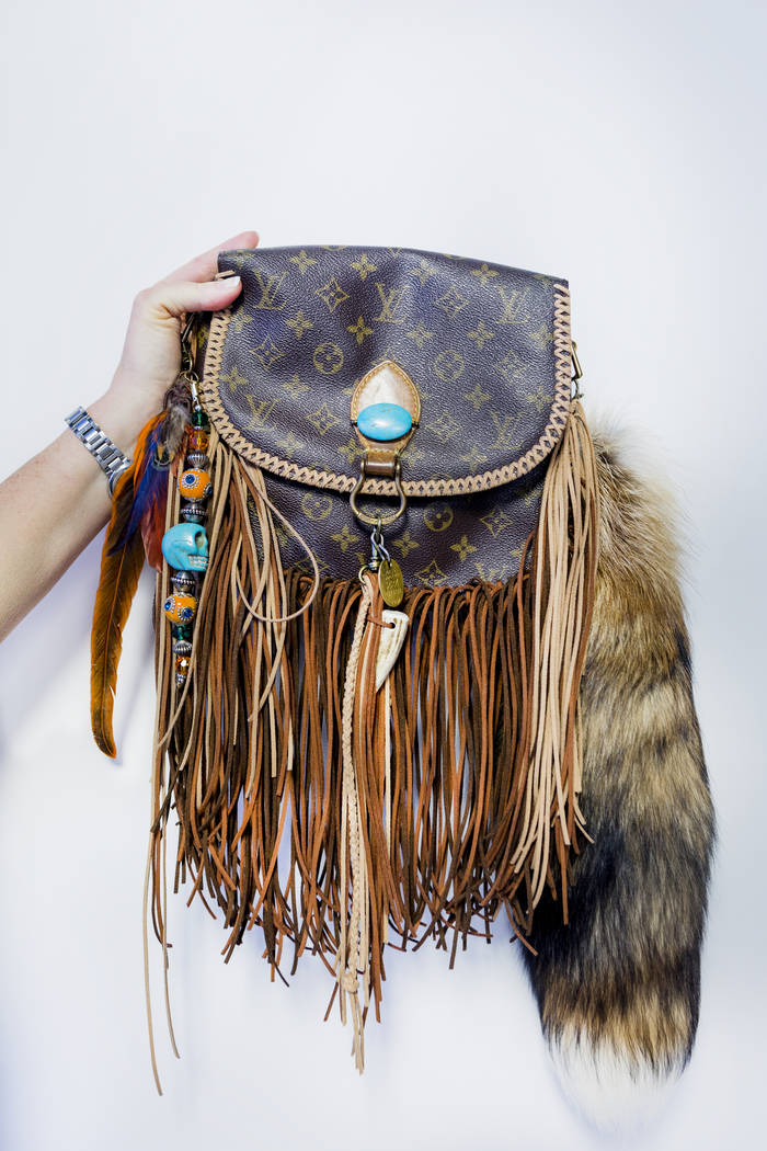 Co-owner of New Vintage Handbags Candace Easdale holds a costume bag in their office in Las Vegas, Wednesday, June 28, 2017. Elizabeth Brumley Las Vegas Review-Journal