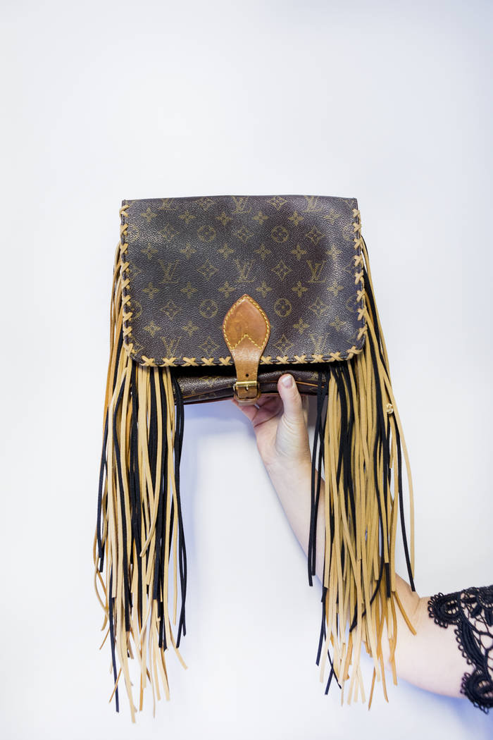 Co-owner of New Vintage Handbags Candace Easdale holds a costume bag in their office in Las Vegas, Wednesday, June 28, 2017. Elizabeth Brumley Las Vegas Review-Journal