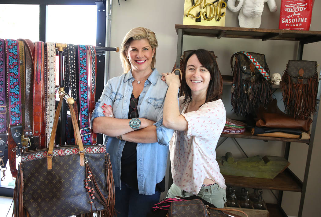 Co-owner of New Vintage, Stephanie Ponder, left, and Tanya Crawford, director of design, display custom purse straps and bags at Ponder's home in Las Vegas on Friday, June 30, 2017. Bizuayehu Tesf ...