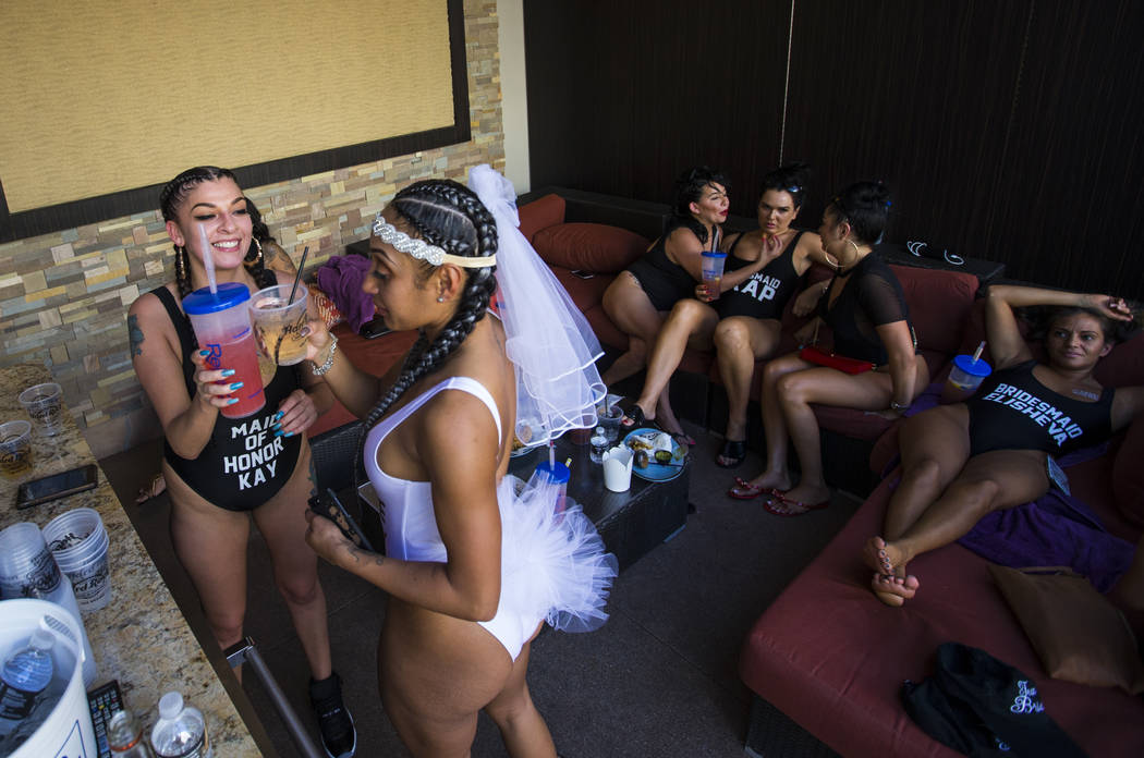 Kayla Gristi, left, cheers Jessica Santana, second from left, at Santana's bachelorette party at Rehab dayclub at Hard Rock Hotel in Las Vegas on Saturday, June 24, 2017. (Chase Stevens/Las Vegas  ...