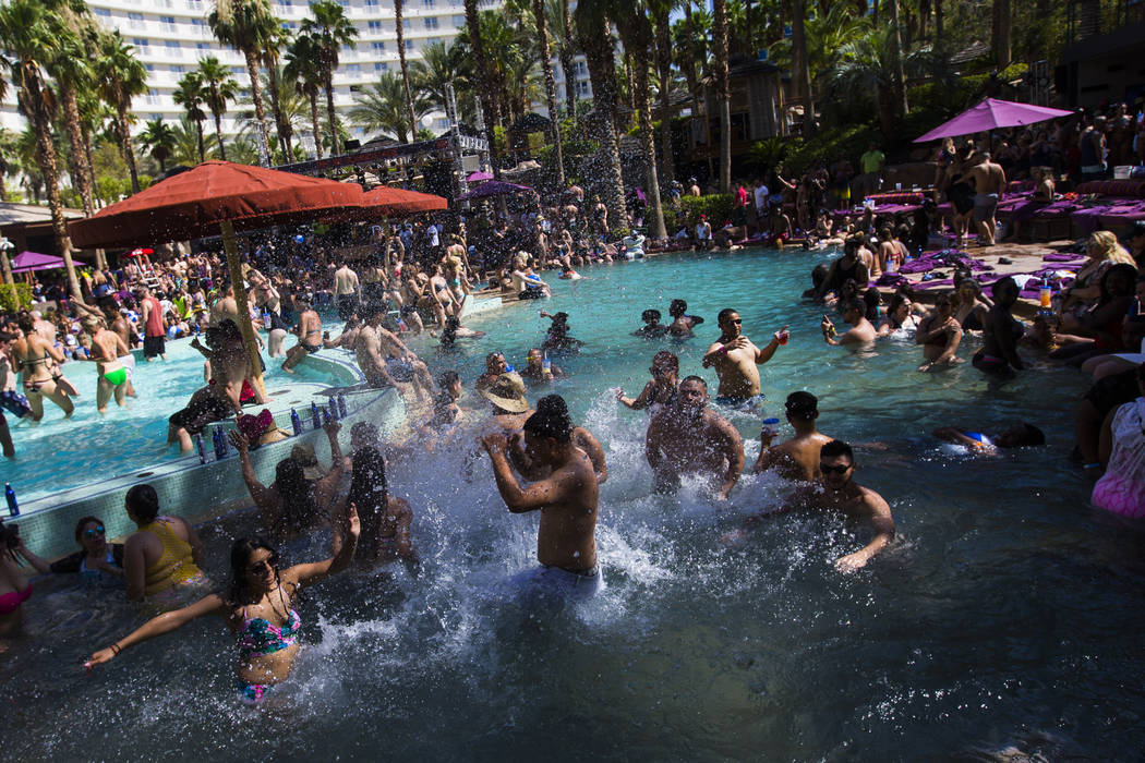 People splash and party in the pool at the Rehab dayclub at Hard Rock Hotel in Las Vegas on Saturday, June 24, 2017. (Chase Stevens/Las Vegas Review-Journal) @csstevensphoto