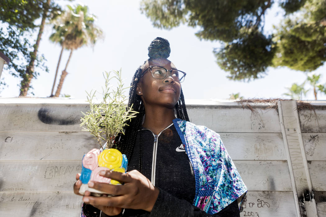 West Prep student Shanette Roberson, 15, holds her handmade pot and planted herb she made at an art summer camp at the late Joyce Straus' home in Las Vegas, Thursday, July 13, 2017. Elizabeth Brum ...